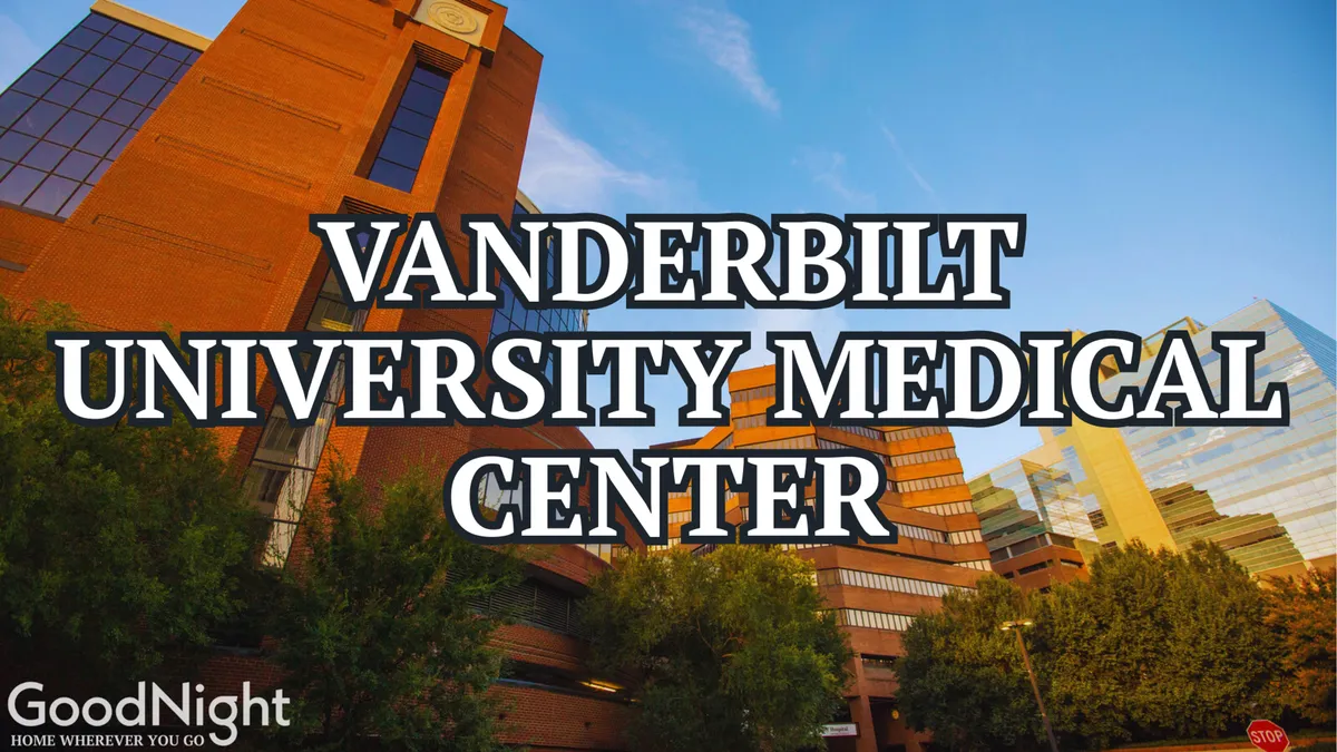 A clear, inviting view of the Vanderbilt University Medical Center building surrounded by lush greenery and a blue sky. The scene conveys a sense of trust, care, and urban convenience.